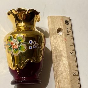 Vintage Ruby Red with gold leaf and hand painted.